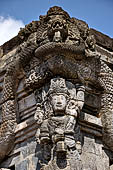 Candi Panataran - Naga Temple. Priestly figure and corner naga. 